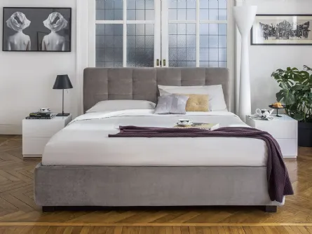 Letto con testiera trapuntata e contenitore Monterey di Calligaris